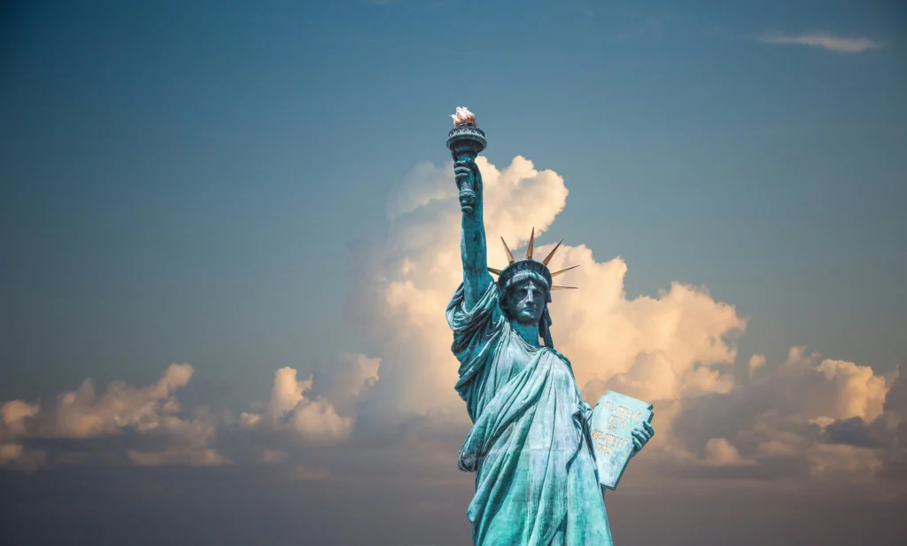 Scenic view of New York Cities Statue of Liberty representing where to buy cheap flights for affordable travel to the city.