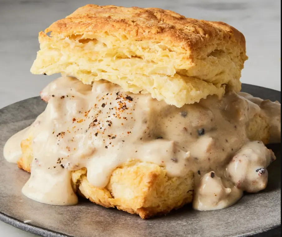 Fluffy biscuits with sausage gravy, classic American foods to try