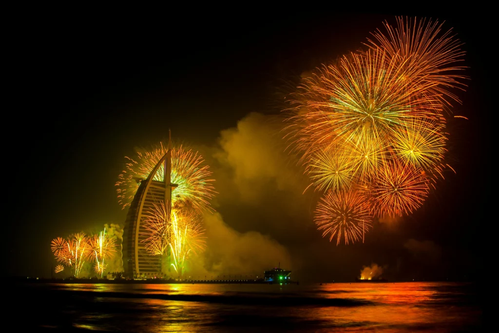 Dubai Burj Khalifa illuminated with New Year’s Eve fireworks and fountain light show