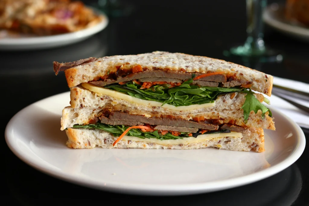 Jibarito sandwich with fried plantains, steak, and vegetables, one of the most distinctive cultural foods in Chicago