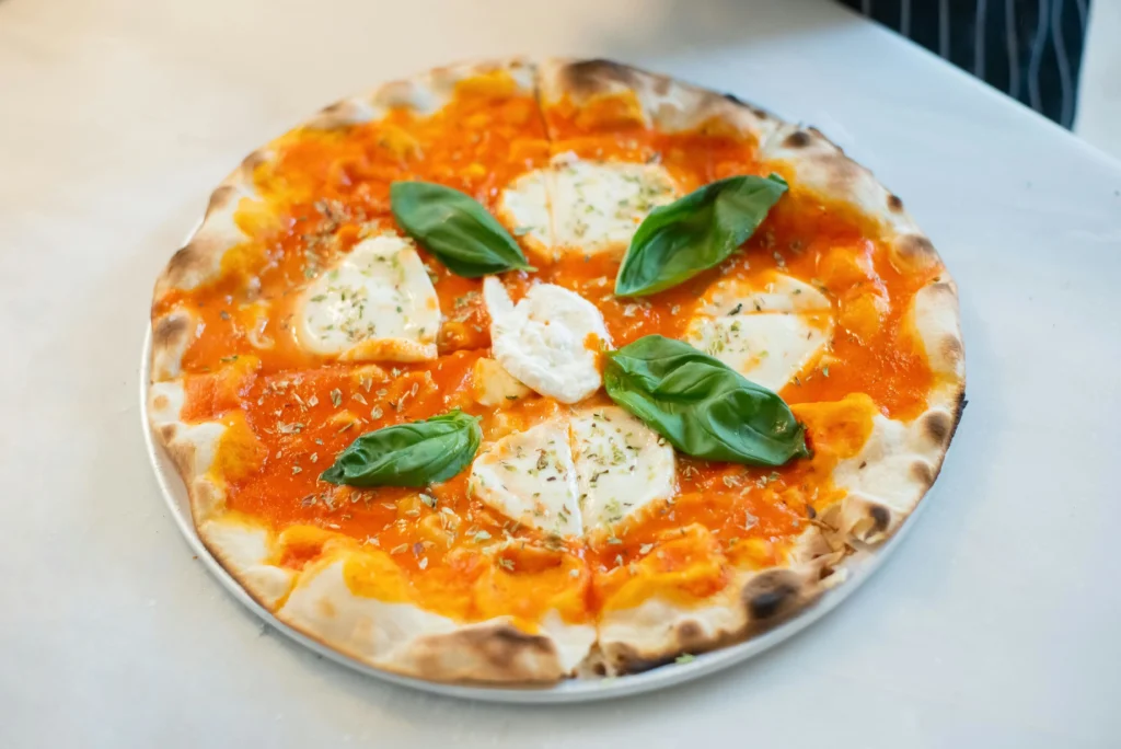 Deep-dish pizza with thick crust, cheese, and tomato sauce, one of the most iconic foods in Chicago